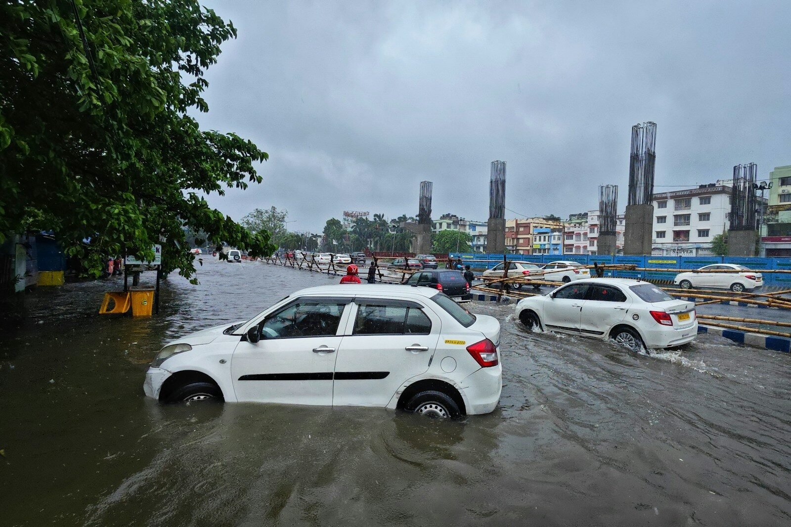 a couple of cars that are in some water